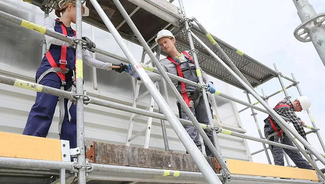 A team of Scaffolders working on some scaffold on a building site